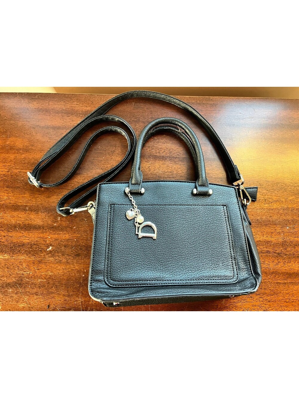 Black Faux Leather Handbag with Dual Handles and Adjustable Shoulder Strap